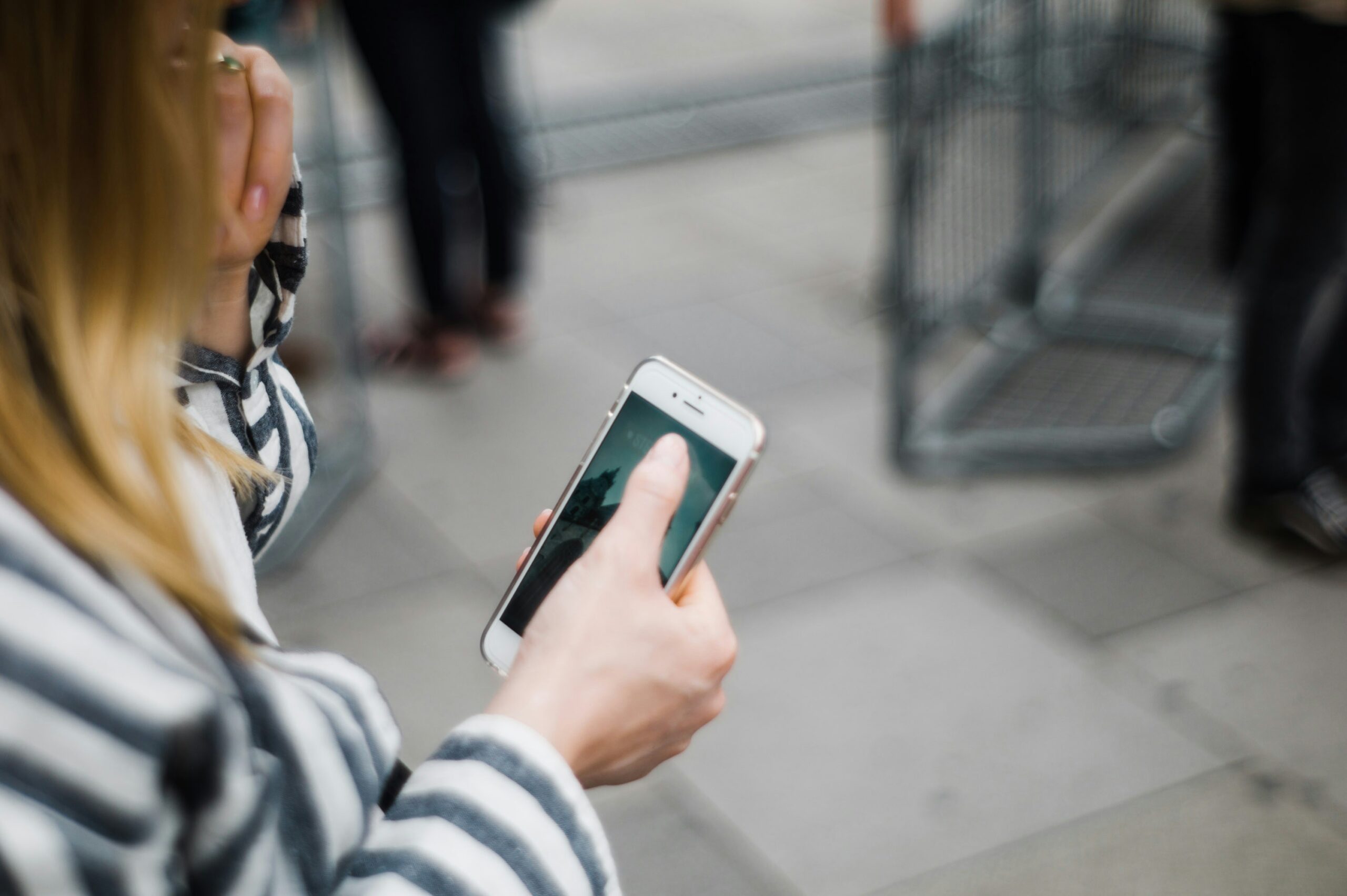 a person using her phone - Nurture Machines a person using her phone