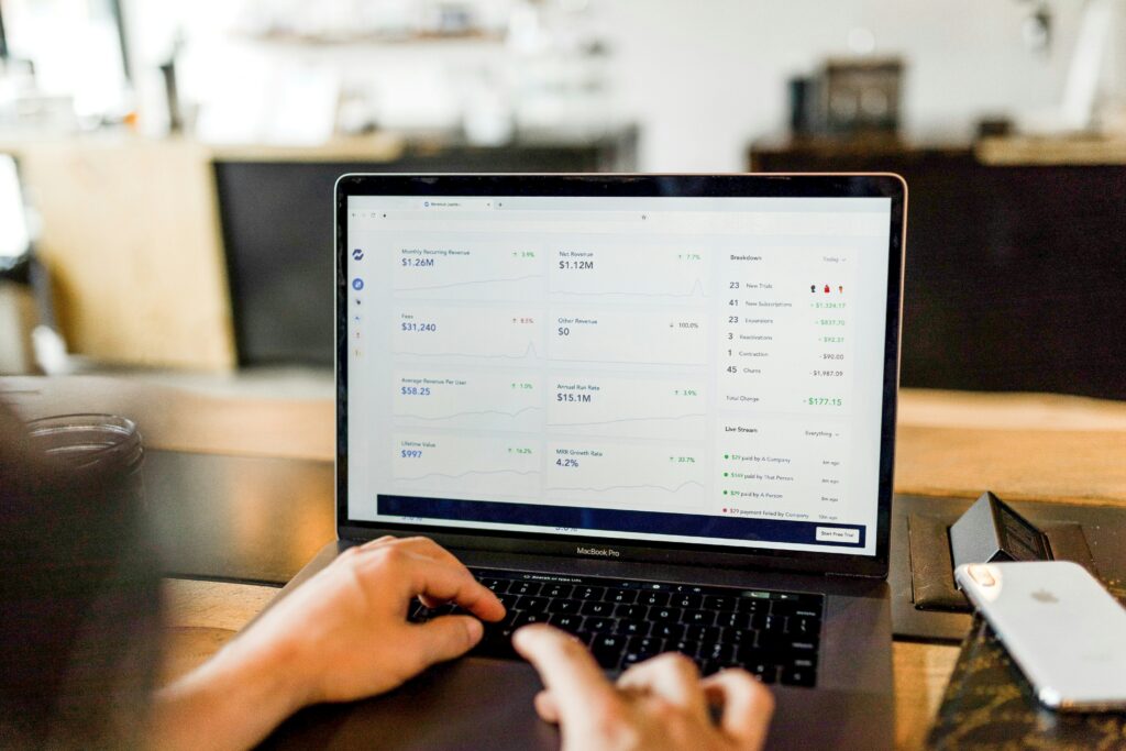 Person analyzing sales funnel performance metrics on a laptop dashboard to track and improve results.