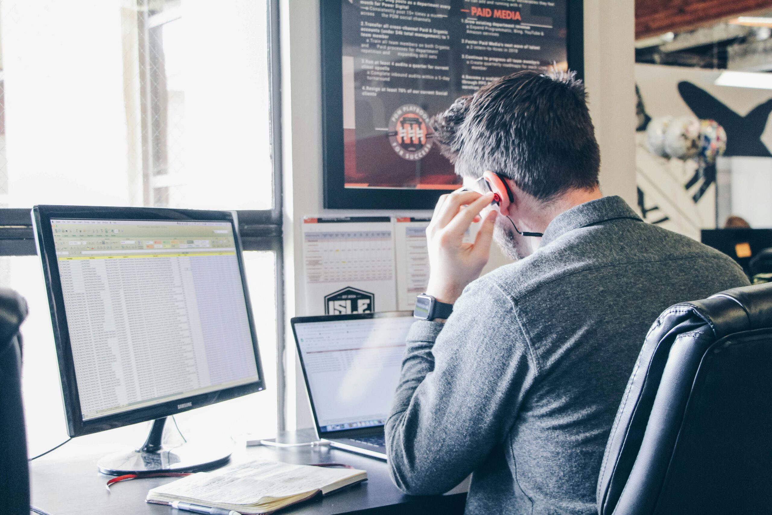 Marketer analyzing data to demonstrate the benefits of lead nurturing automation tools