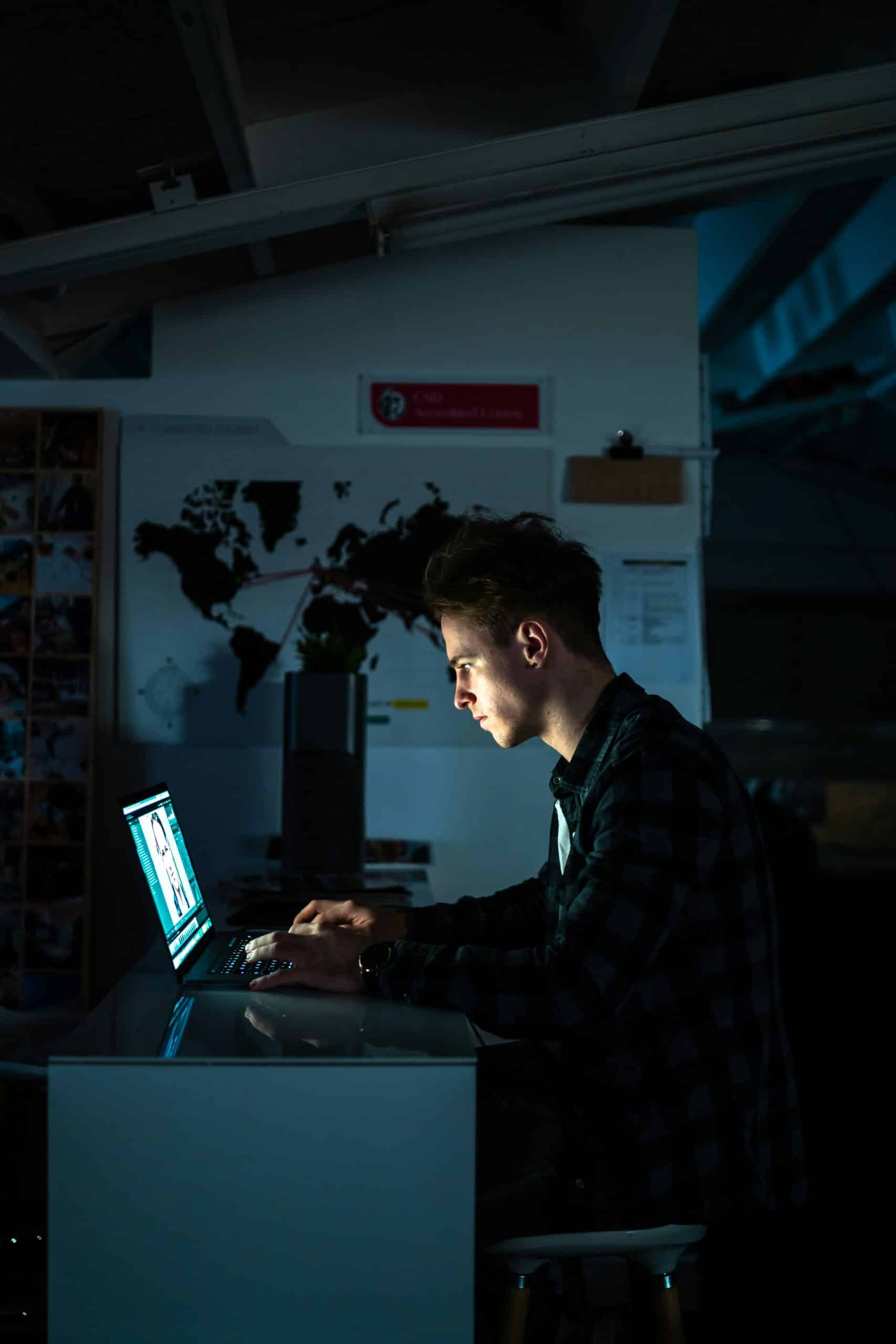 a person working on their computer - Nurture Machines a person working on their computer