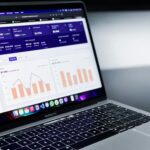 A laptop displaying a CRM dashboard with automated sales metrics and subscription data for streamlined funnel management.