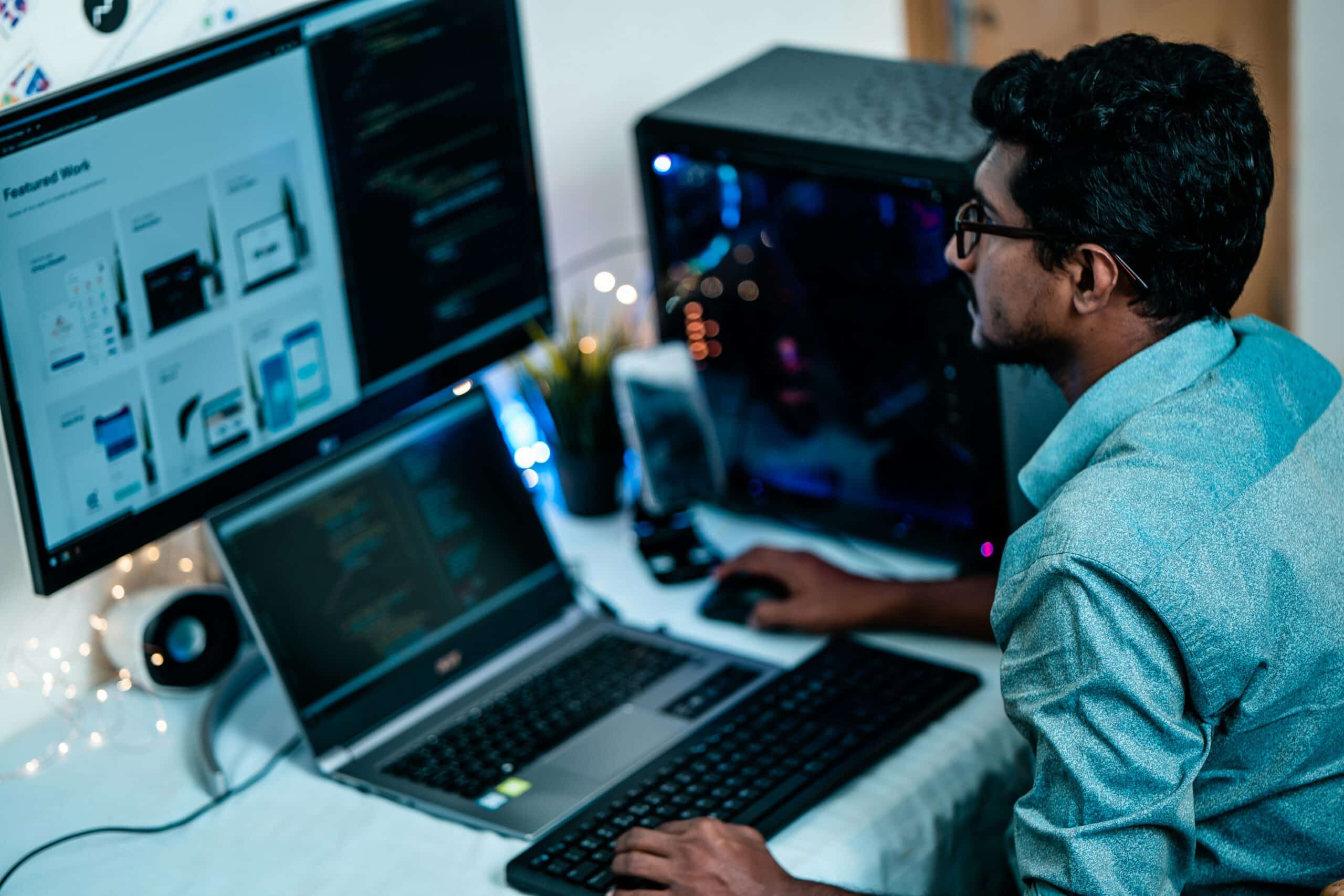  Developer analyzing brand experience and product design on dual screens for customer engagement