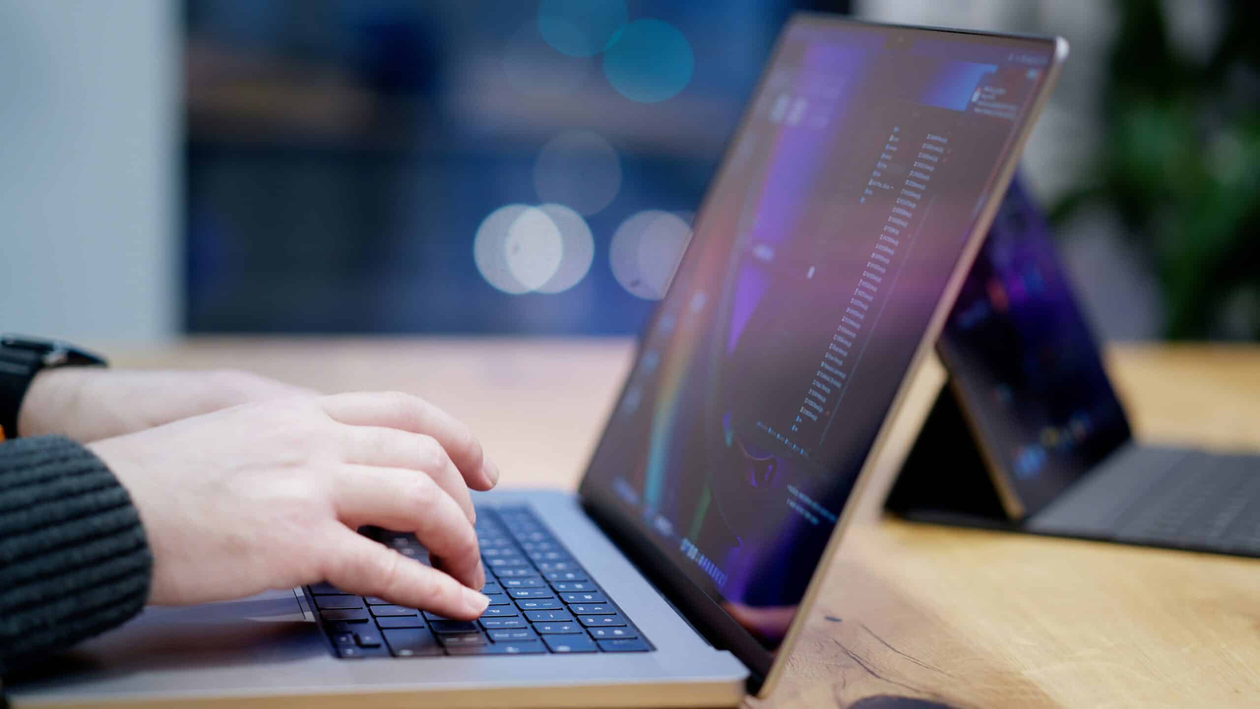 Professional analyzing customer journey data on a laptop