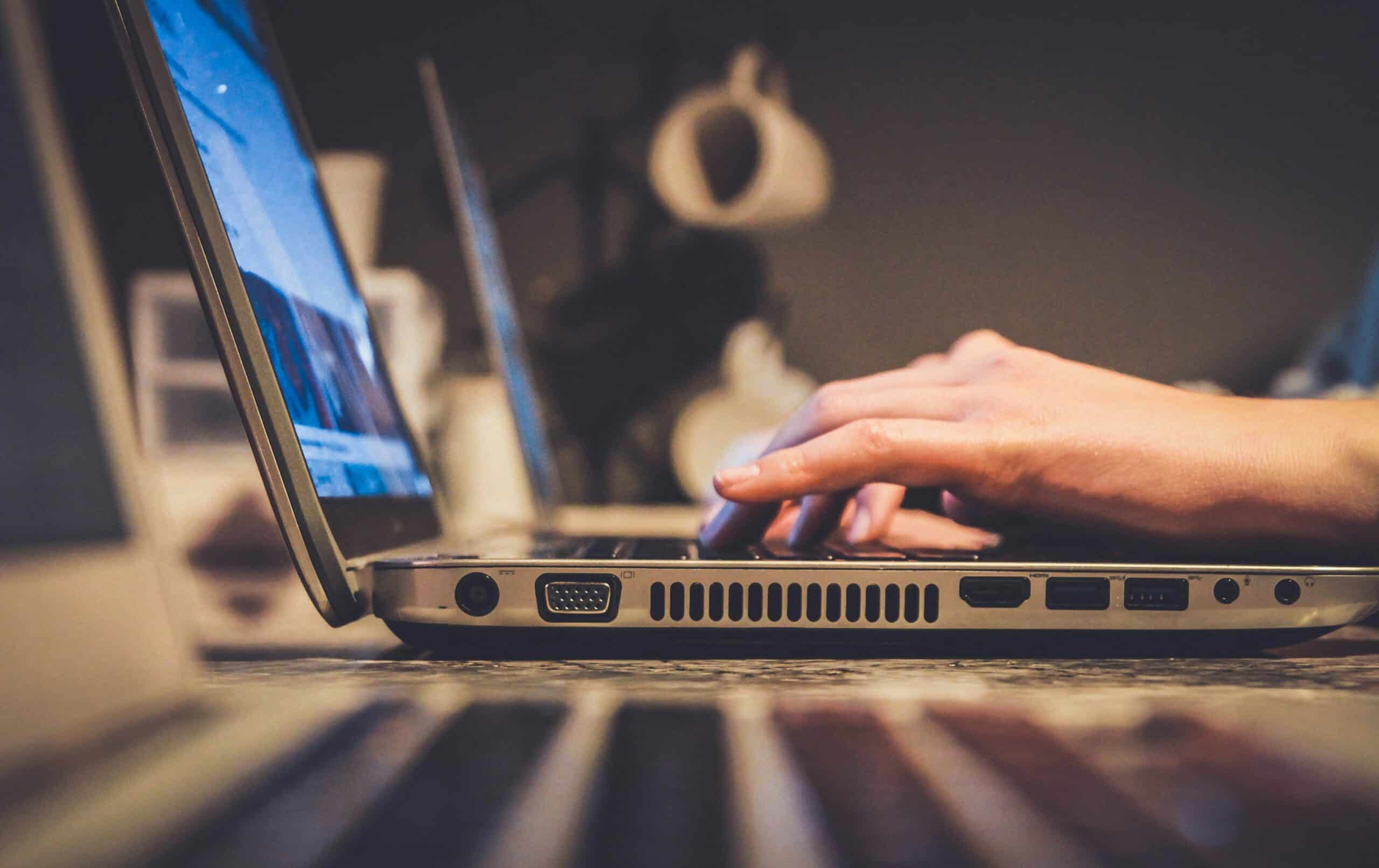 A person analyzing data on a laptop, representing the process of tracking and evaluating cart abandonment rates through digital analytics tools. - Nurture Machines A person analyzing data on a laptop, representing the process of tracking and evaluating cart abandonment rates through digital analytics tools.