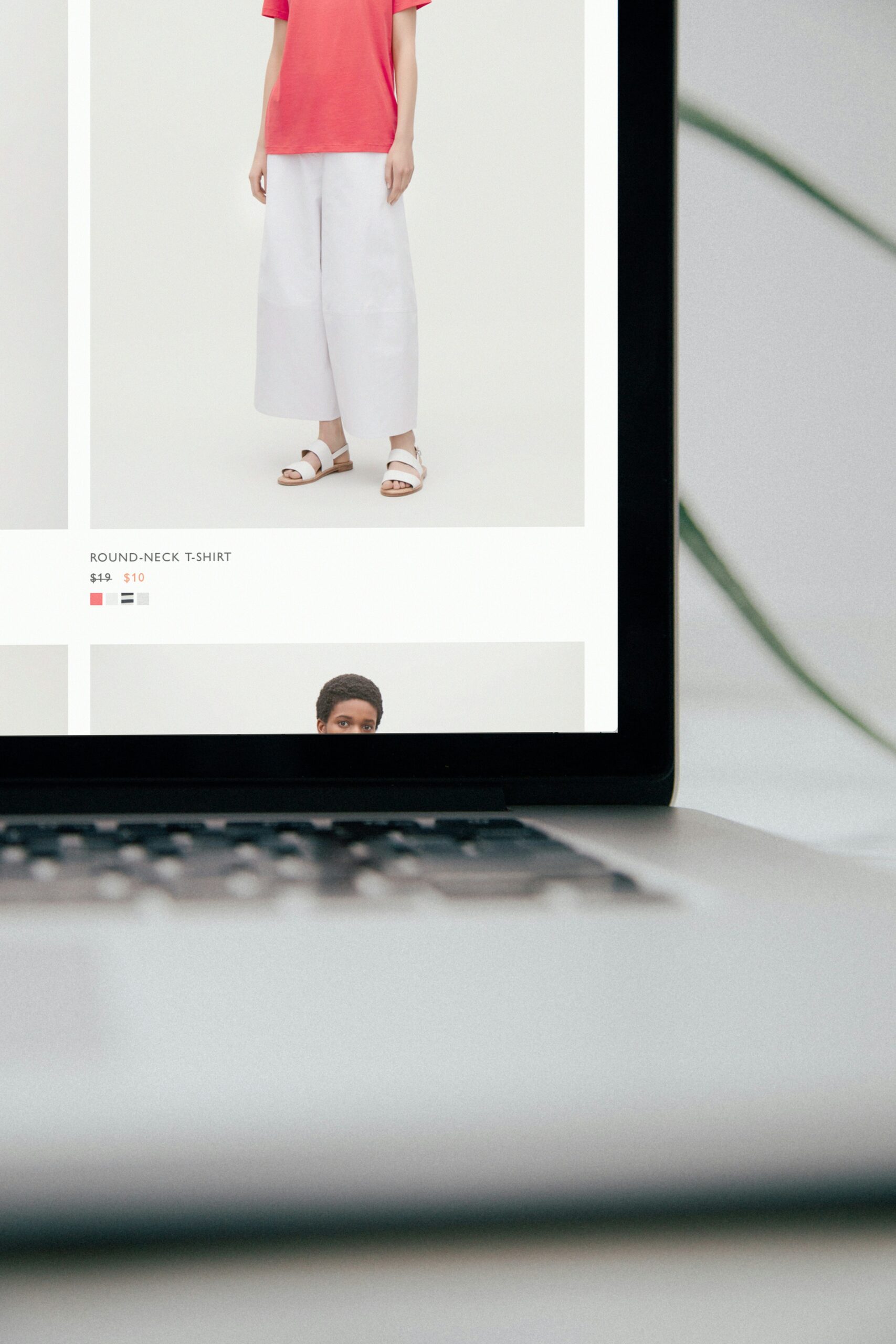 A laptop screen displays an online clothing store with sale pricing, highlighting the importance of a streamlined checkout experience to boost sales completion.