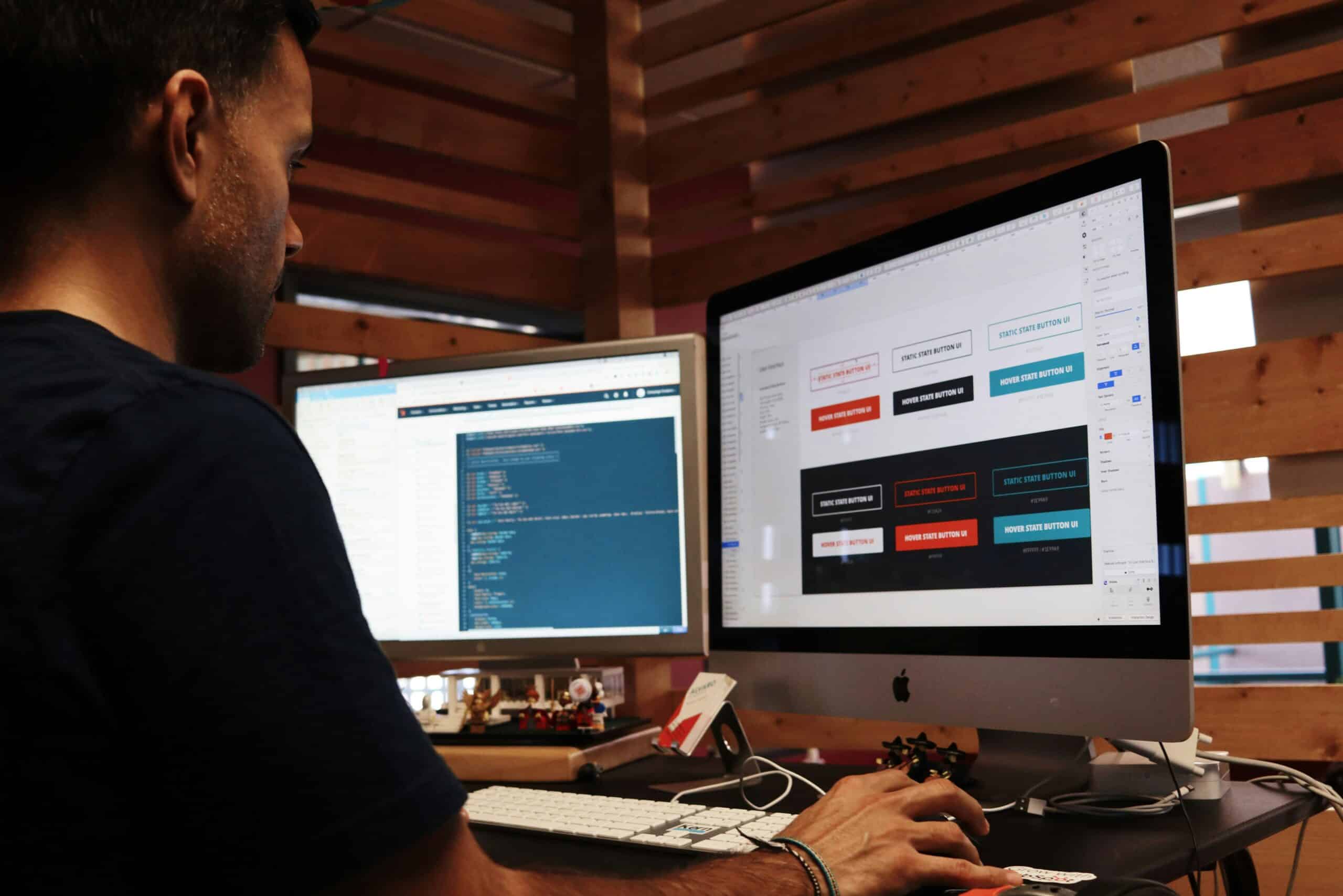 A man working on building a website. - Nurture Machines A man working on building a website.
