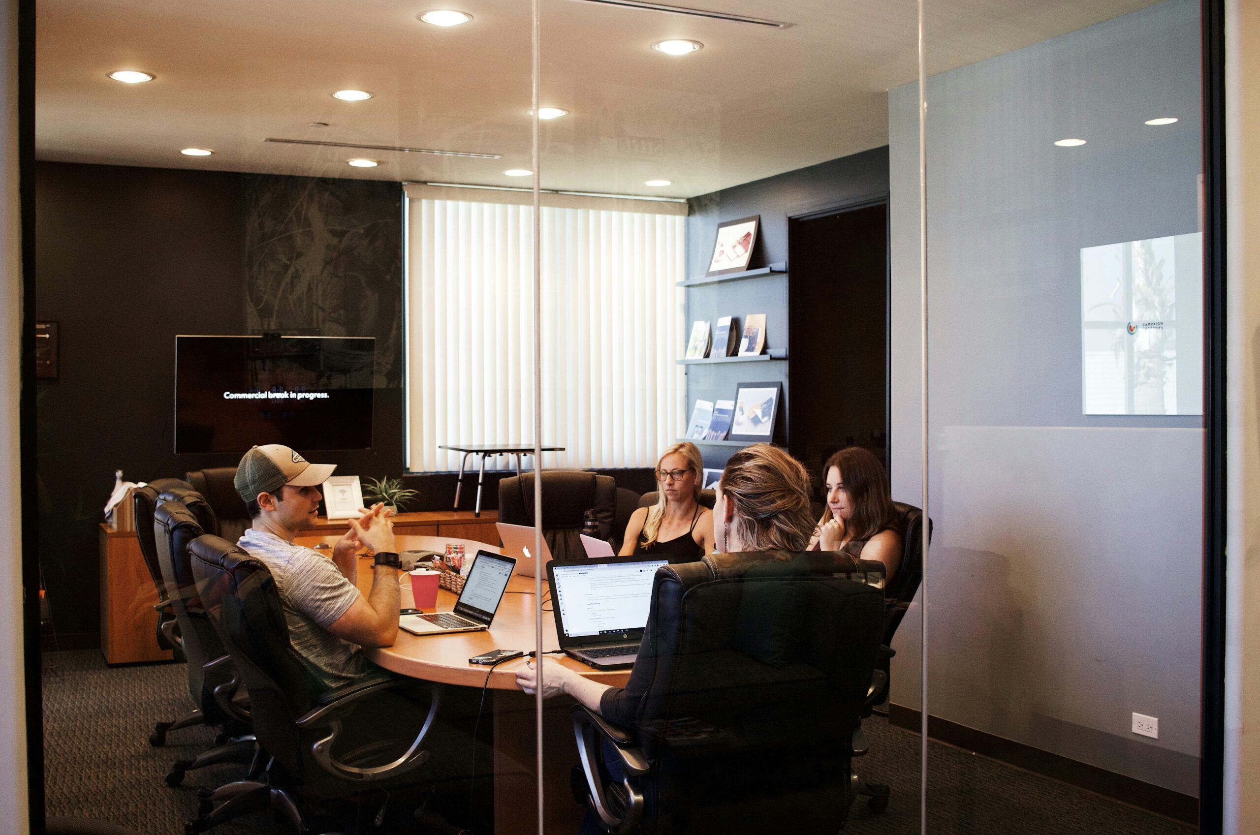 A team engaged in a business meeting inside a conference room, representing the importance of customer acquisition reputation in shaping strategic decisions and client perceptions. - Nurture Machines A team engaged in a business meeting inside a conference room, representing the importance of customer acquisition reputation in shaping strategic decisions and client perceptions.