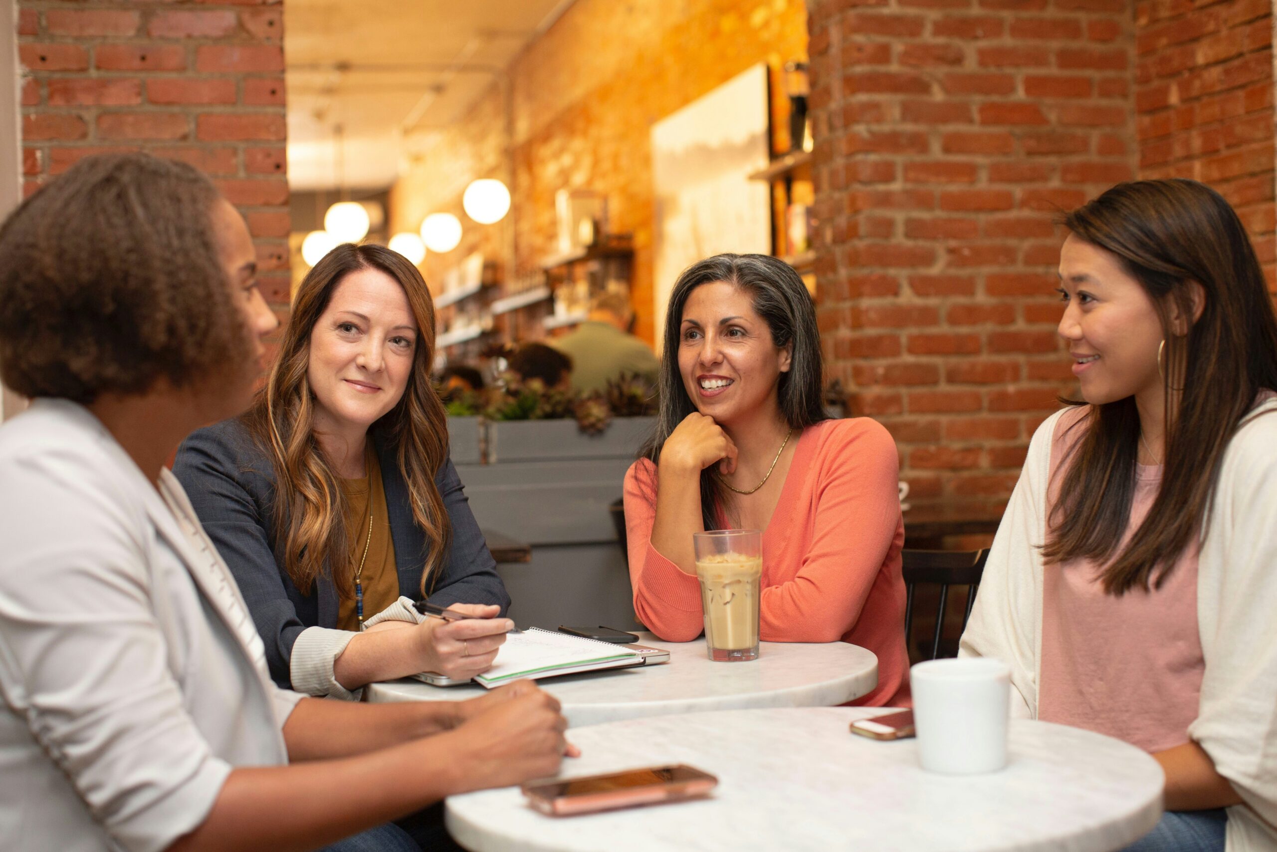 A group of professionals engage in a collaborative café meeting, highlighting how open communication and strategic planning foster stronger, more effective customer retention teams. - Nurture Machines A group of professionals engage in a collaborative café meeting, highlighting how open communication and strategic planning foster stronger, more effective customer retention teams.