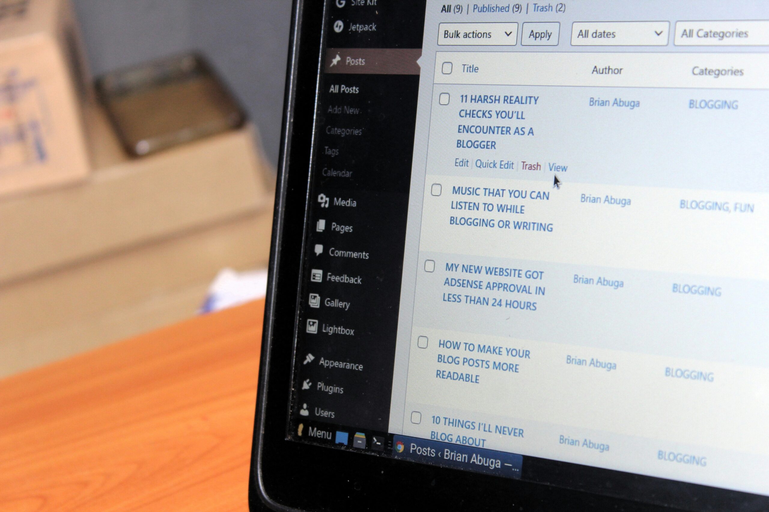 A laptop screen displaying blog post drafts, ideal for organizing content into topic clusters and adding internal links for funnel optimization.