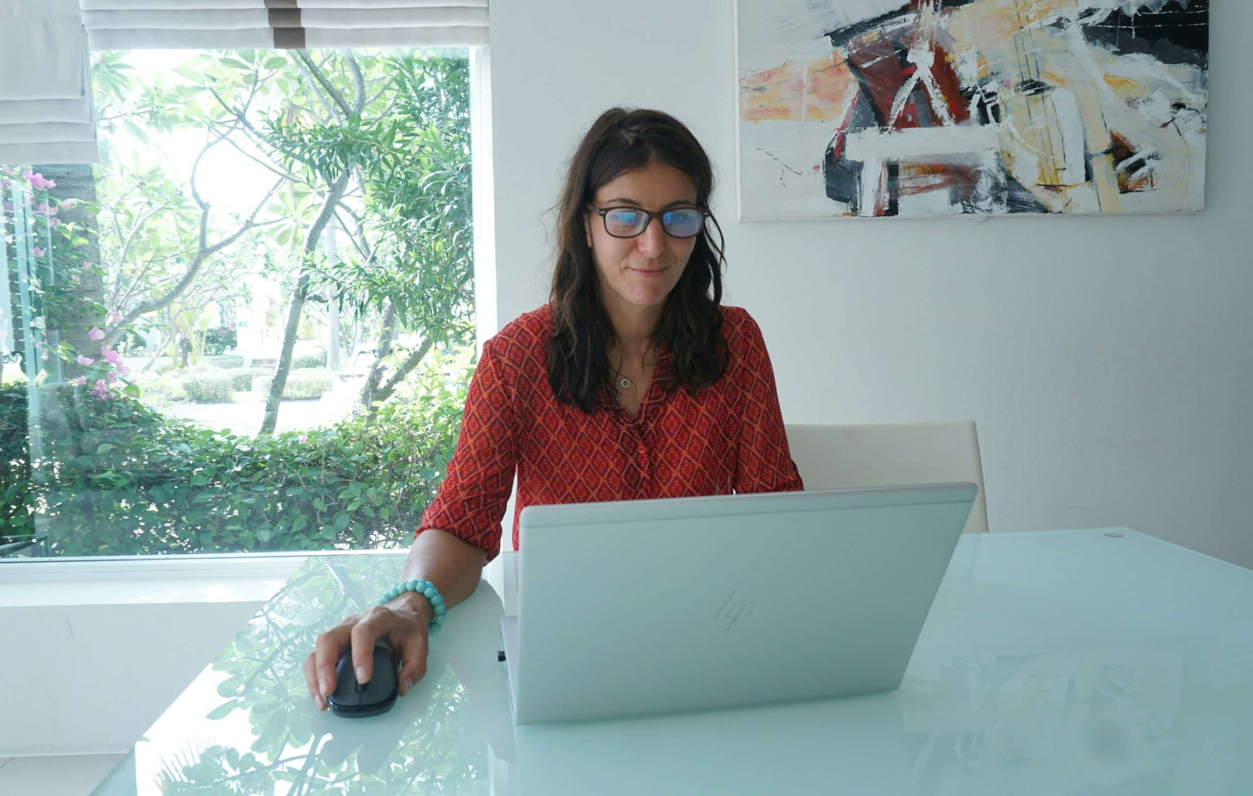 A woman working on a laptop at a bright desk, representing how CRM integration streamlines middle funnel lead management and follow-ups. - Nurture Machines A woman working on a laptop at a bright desk, representing how CRM integration streamlines middle funnel lead management and follow-ups.